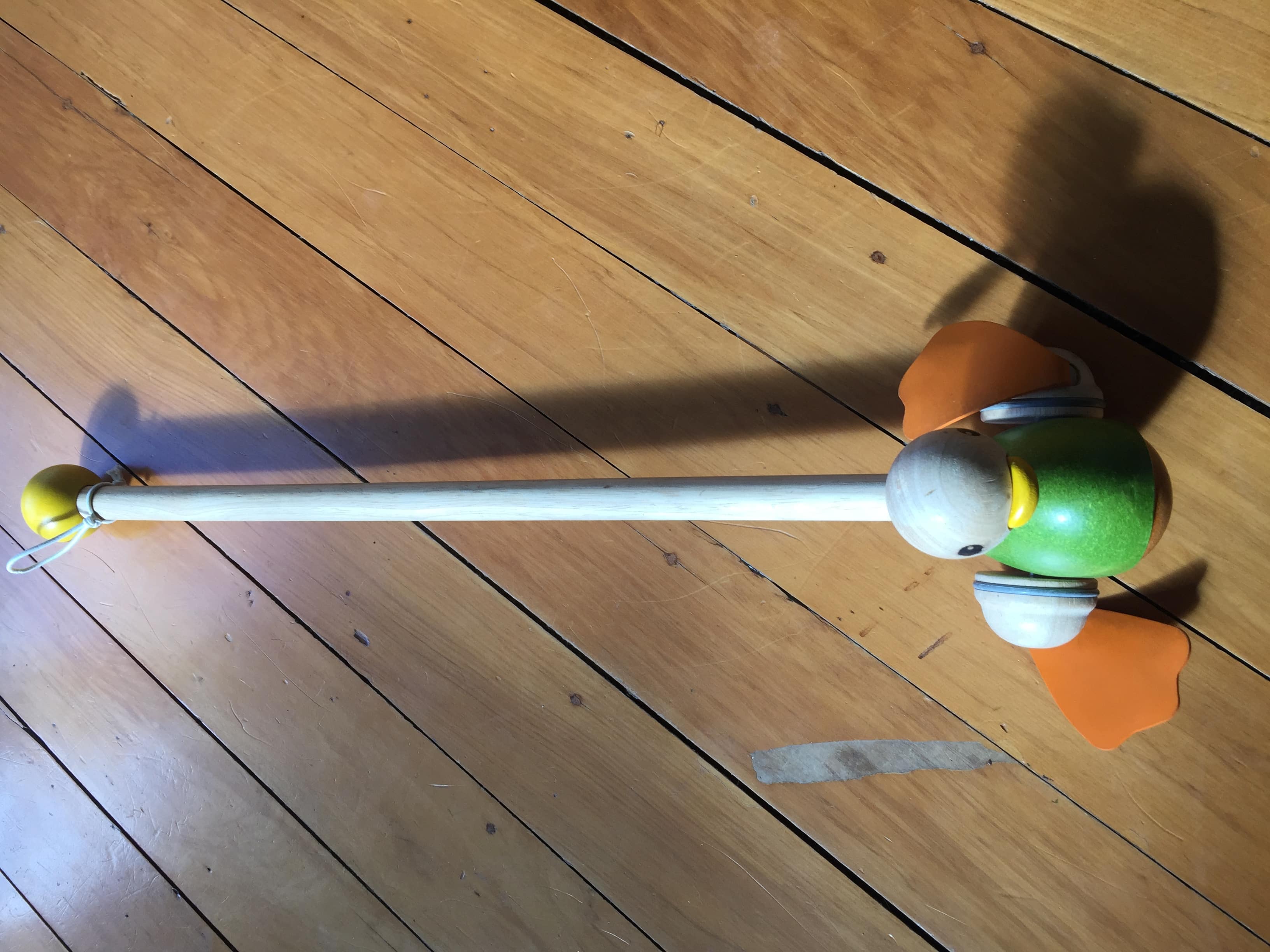 wooden duck toy on a stick